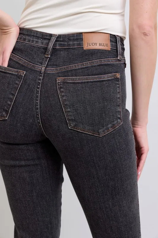 judy-blue-mid-rise-tummy-control-slim-jeans-side-view-stretchy-comfort