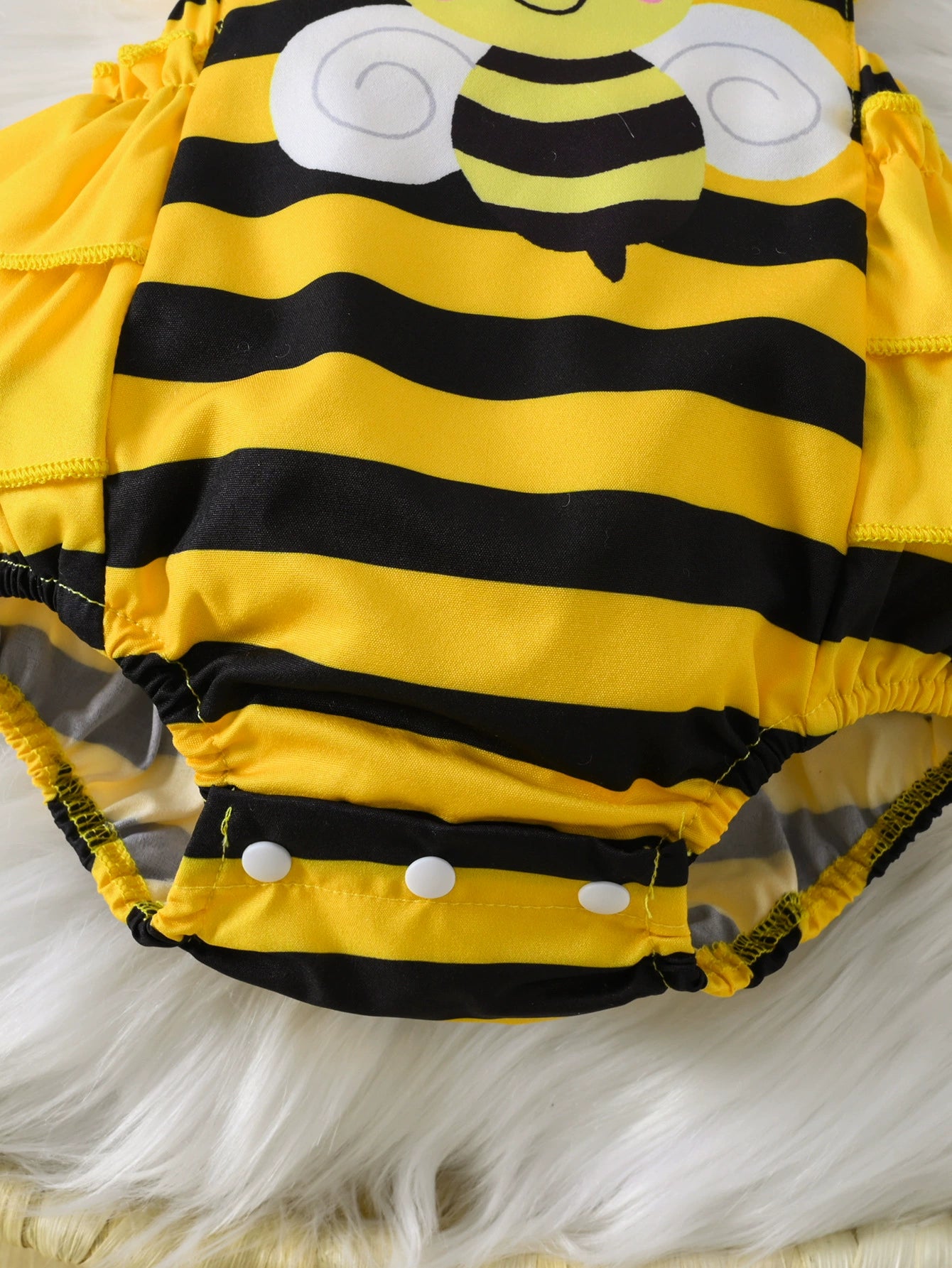 close-up-kids-bee-striped-ruffle-bodysuit-dress-detail