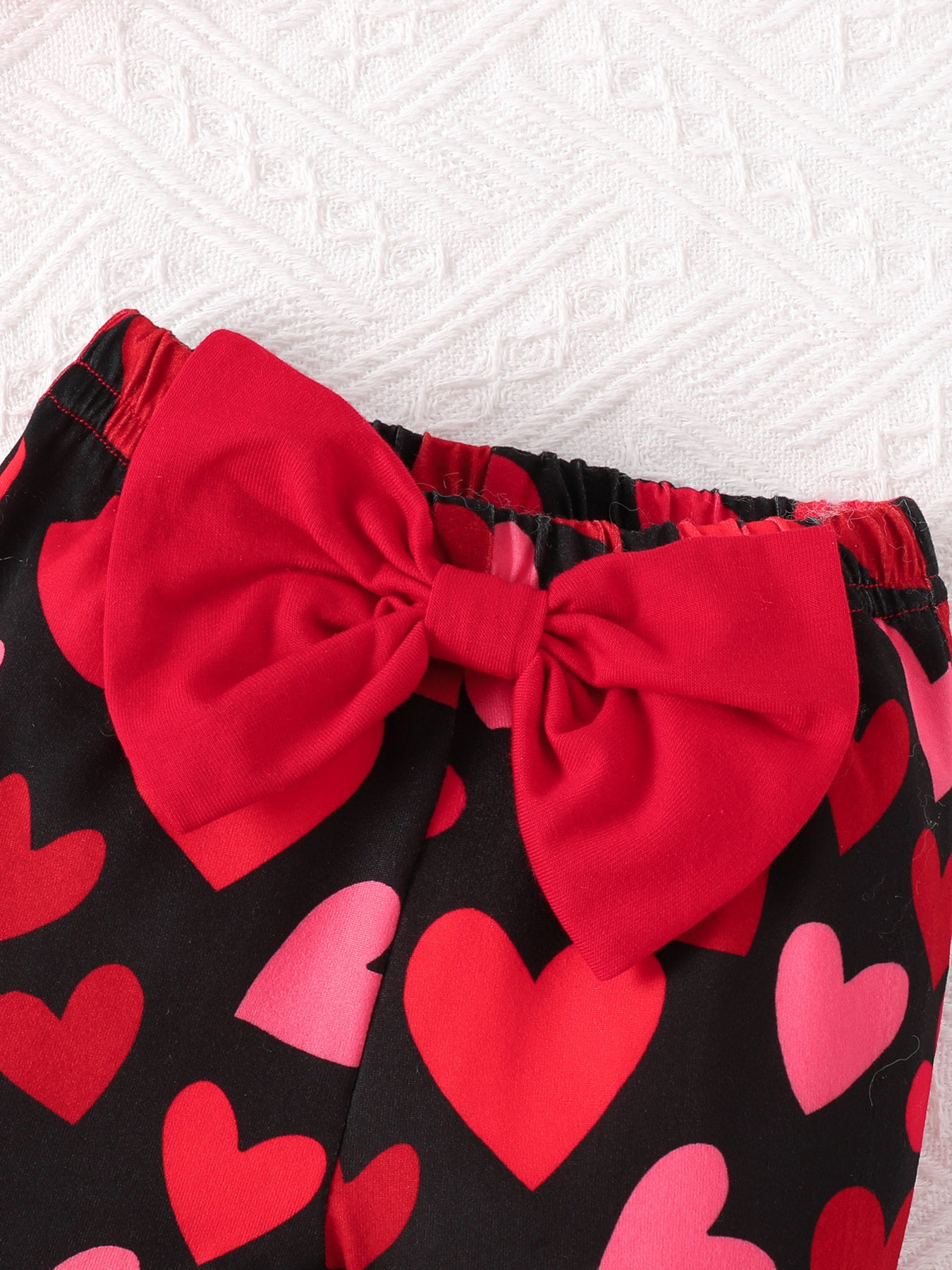 close-up-kids-letter-ruffled-bodysuit-detail